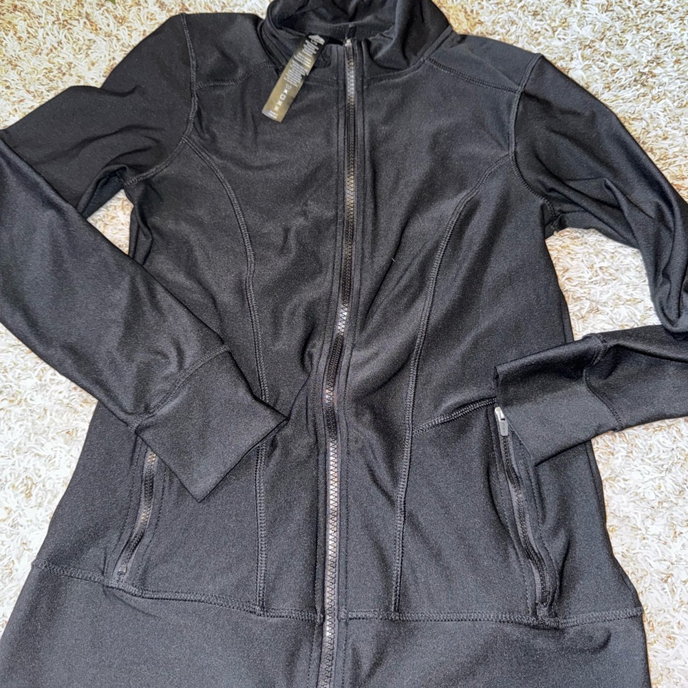 Reebok ladies large running jacket. Compression fit.